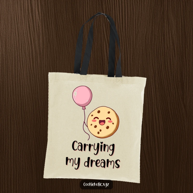 Funny tote bag with a happy cookie character floating upwards, held aloft by a delicious-looking balloon made of frosting.